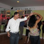 Miguel and salsera dancing at Dance Fever Studios' Party.