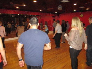 Latin dance instruction at Brooklyn dance school.